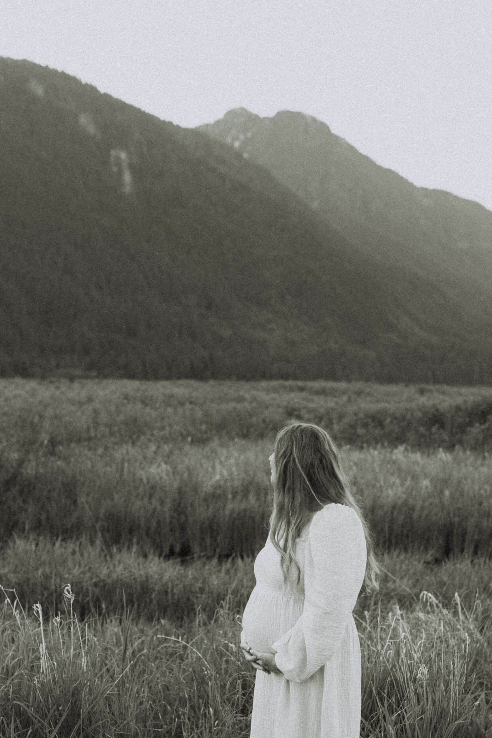 black and white photo of a pregnant woman taken among the fraser valley mountains