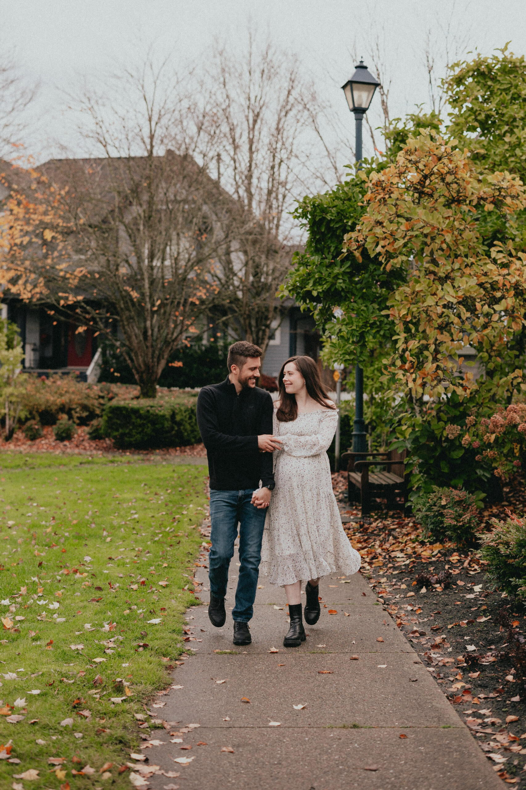 photo of a couple walking in a fall landscape, posted for a Langley restaurants date night blog 